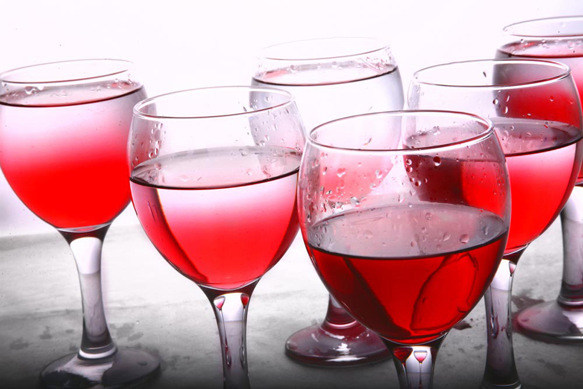 Close-up of red wine glasses